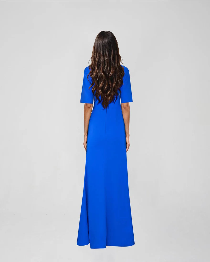 Woman wearing blue Raya Maxi Dress with half sleeves and high slit — ATOIR | Endless UAE