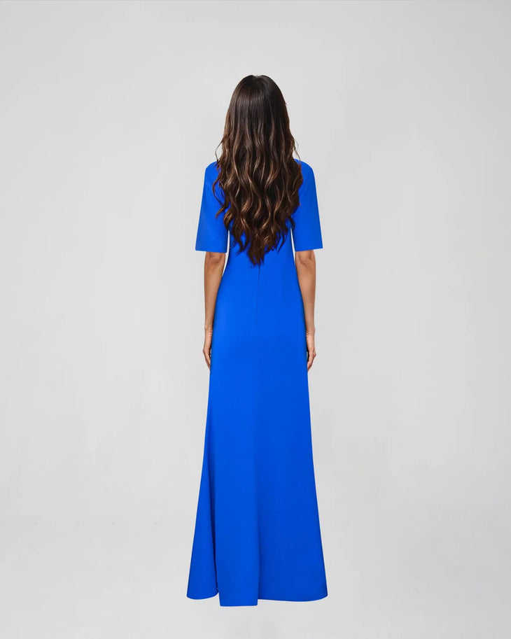 Woman wearing blue Raya Maxi Dress with half sleeves and high slit — ATOIR | Endless UAE