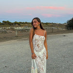 White lace camisole maxi dress styled with accessories in a desert setting — Scorpio Rizing | Endless UAE
