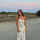White lace camisole maxi dress styled with accessories in a desert setting — Scorpio Rizing | Endless UAE