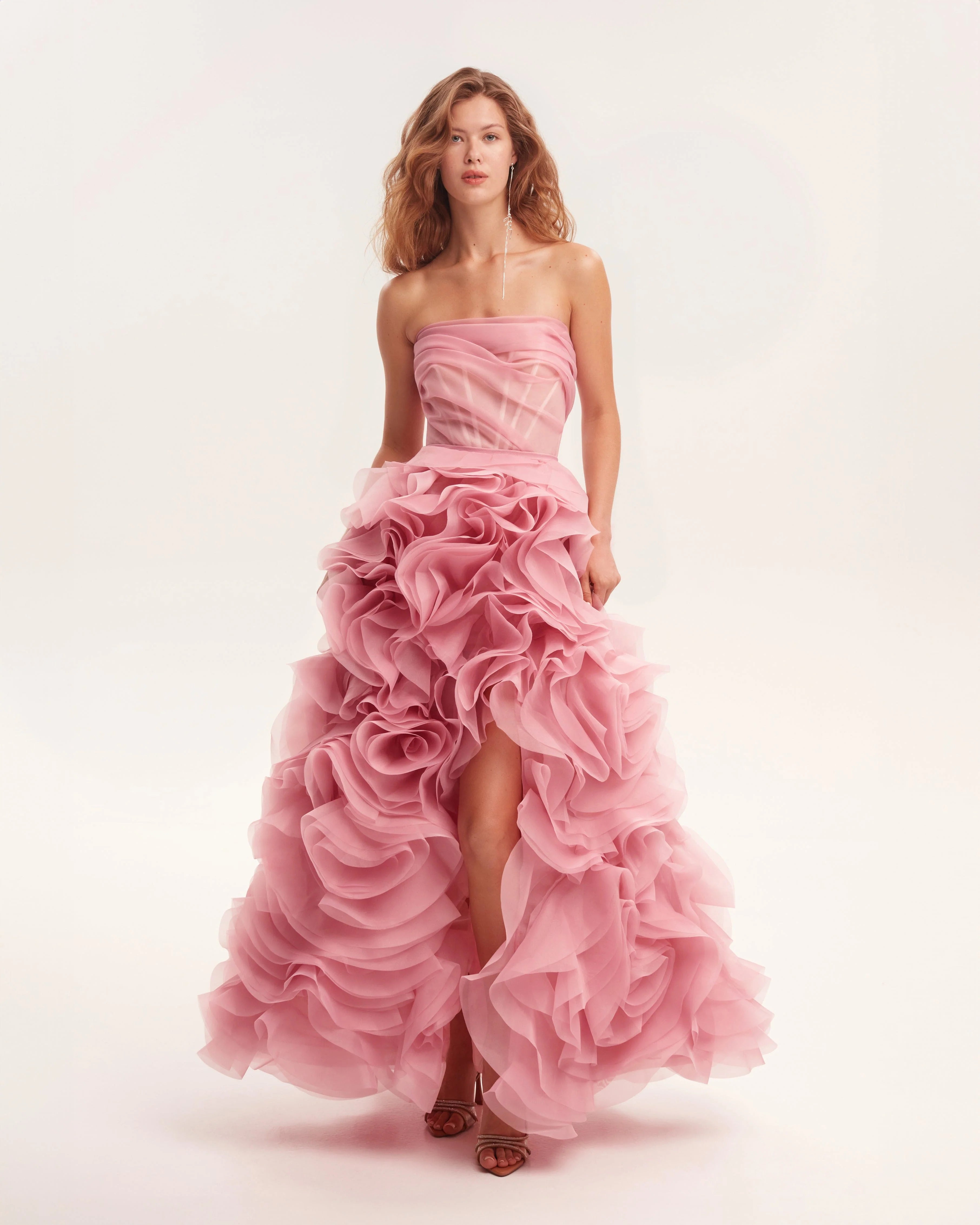 Strapless pink maxi dress with voluminous rose appliqué ruffles and dramatic high-low hemline — Milla | Endless UAE