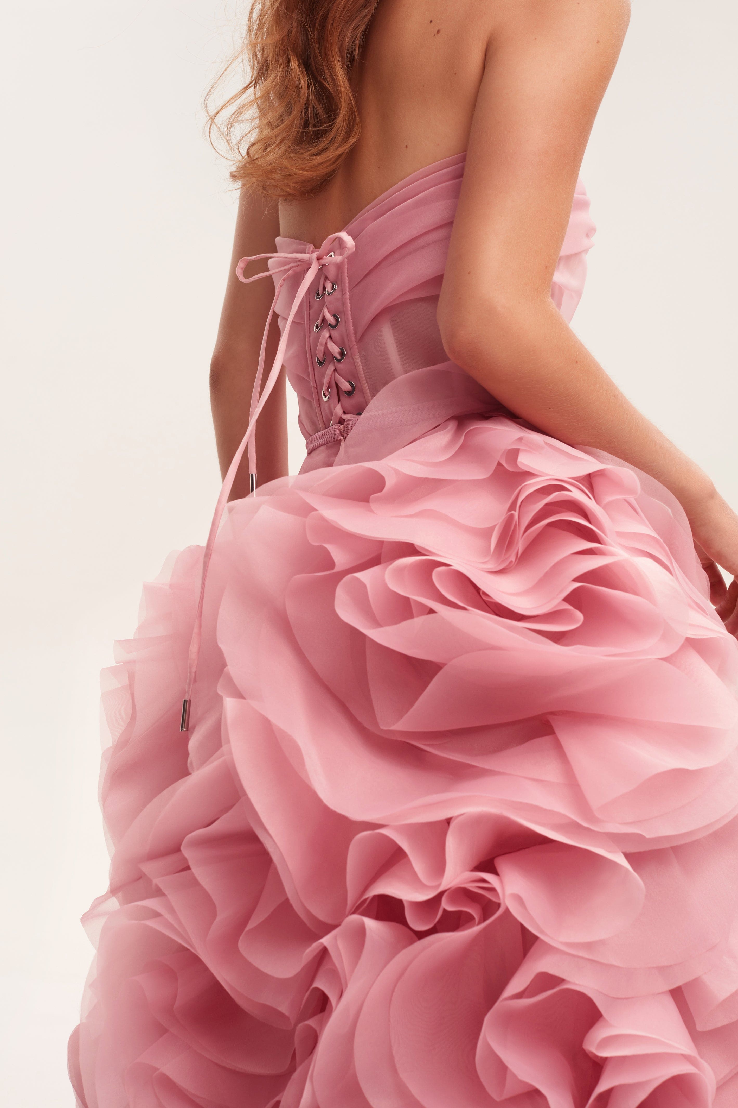Pink strapless maxi dress with dramatic cascading rose appliques and corset-style lace-up back detail — Milla | Endless UAE
