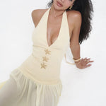 Woman in elegant cream halter dress with starfish details and tulle skirt — Vivienne Collection | Endless UAE