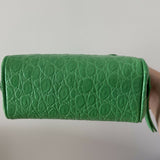 Green crocodile-embossed mini tote bag with gold hardware held by hand — By Far | Endless UAE