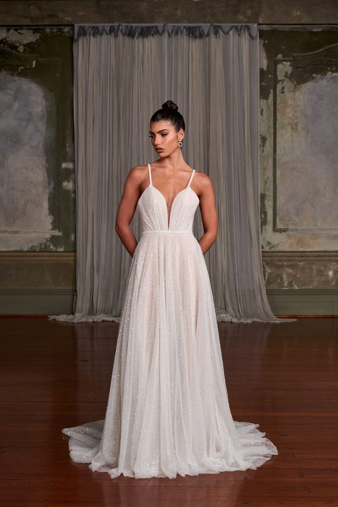 Indy wedding dress with plunging neckline and flowing skirt — Evie Young | Endless UAE