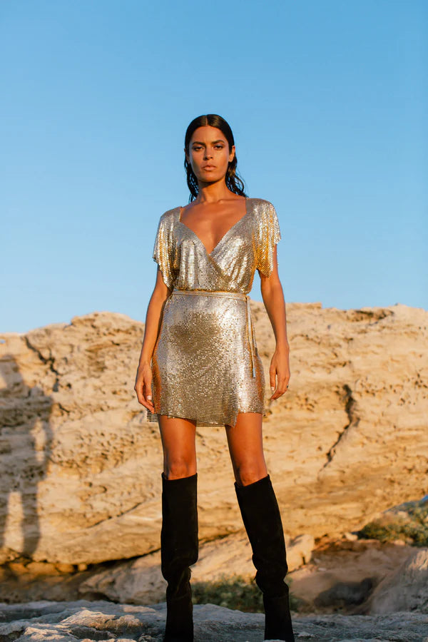 Gold sequin wrap dress with short sleeves styled with black boots — Isabel Moore | Endless UAE