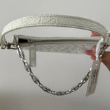 White quilted mini shoulder bag with silver hardware held up against neutral background — By Far | Endless UAE