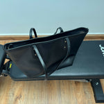 Black leather tote bag with dual handles and Coach branding — Coach | Endless UAE