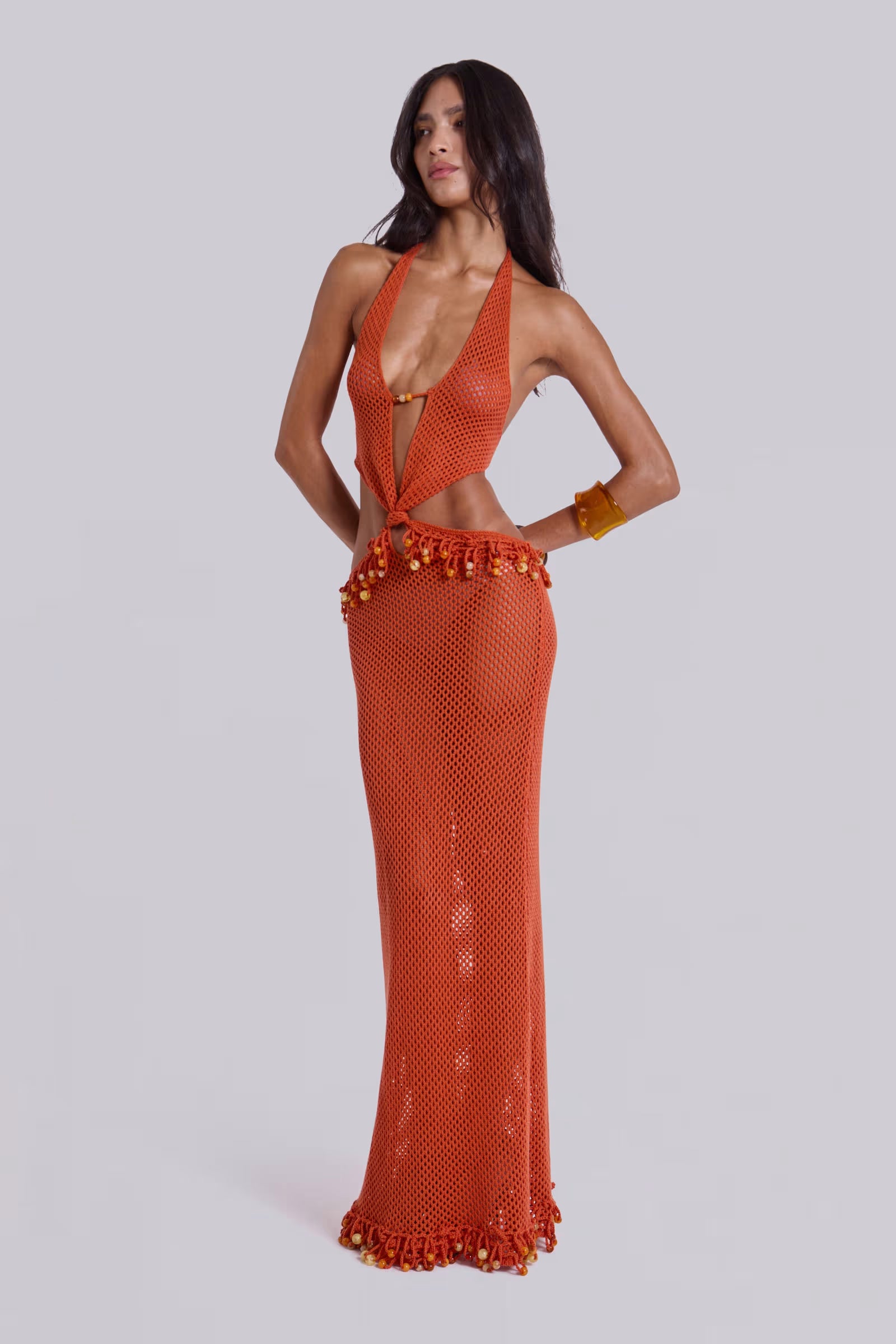 Woman wearing orange beaded crochet halter maxi dress with open back — Jaded London | Endless UAE