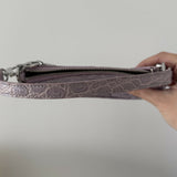 Mini Rachel Lilac Croco Embossed Leather Bag held in hand against white background — By Far | Endless UAE