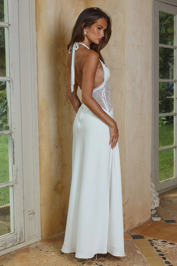 White halter maxi dress with lace bodice and open back, flowing skirt, elegant formal style — Runaway The Label | Endless UAE