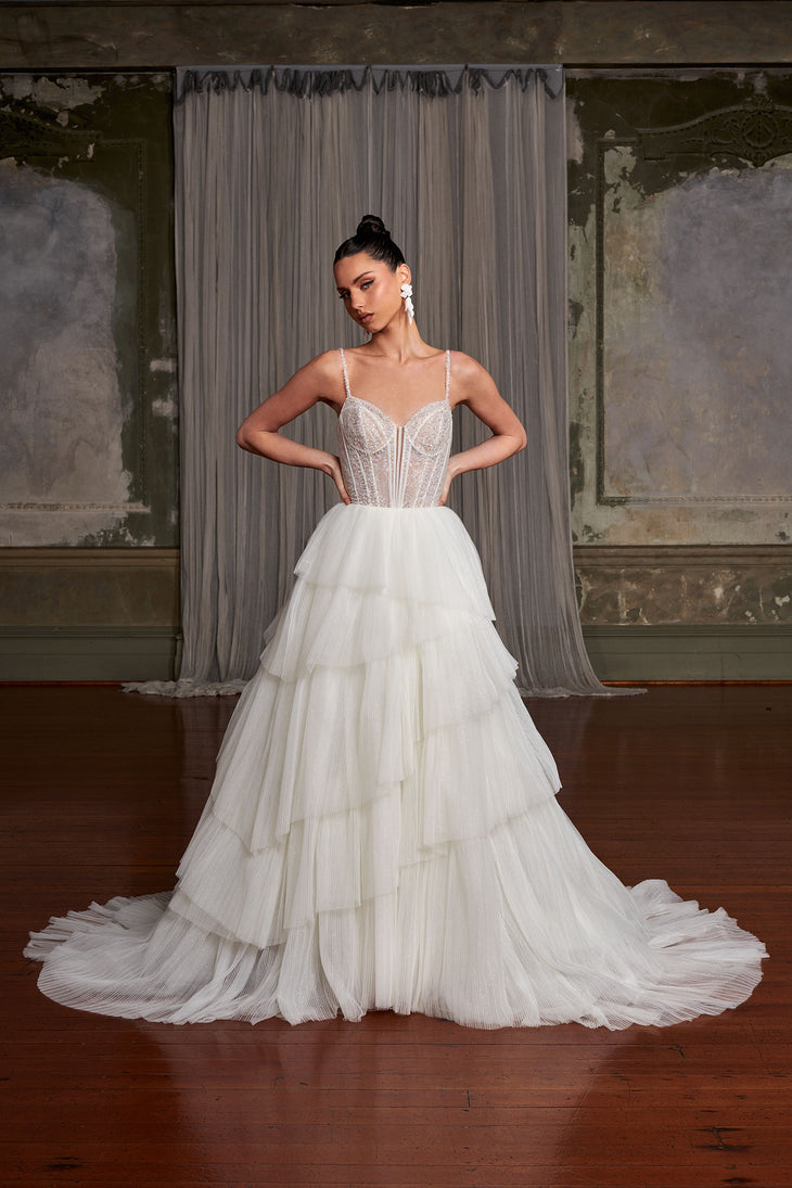 Romantic tiered tulle ballgown wedding dress with beaded corset bodice and spaghetti straps — You&I Bridal | Endless UAE