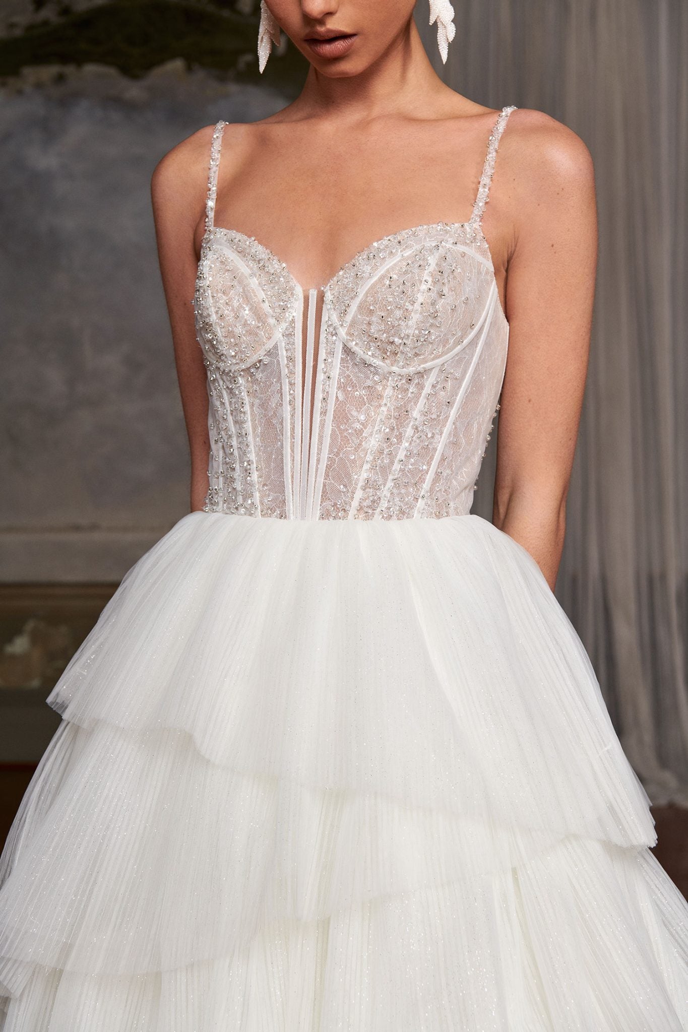 Beaded corset wedding dress with tiered tulle skirt and thin straps — You&I Bridal | Endless UAE