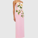Woman wearing pink strapless maxi dress with white floral appliqué — Leo Lin | Endless UAE