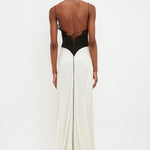 Woman wearing black lace insert bodysuit with cream floor-length skirt — Victoria Beckham | Endless UAE