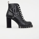 Black leather lace-up ankle boot with logo detailing, chunky block heel and lug sole — Louis Vuitton | Endless UAE