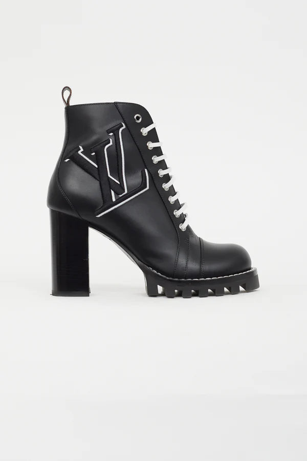 Black leather lace-up ankle boot with logo detailing, chunky block heel and lug sole — Louis Vuitton | Endless UAE