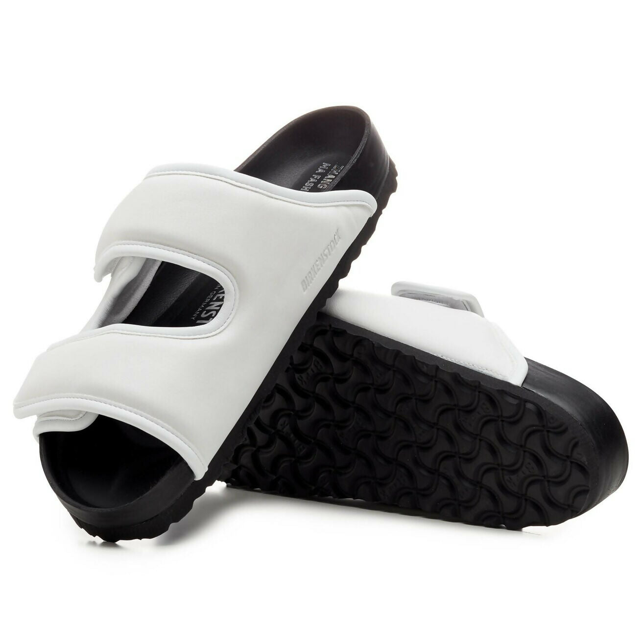 White and black CSM Cosy slip-on sandals with contoured footbed and textured sole — 1774 Birkenstock | Endless UAE
