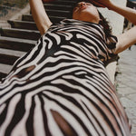 Woman wearing black and cream zebra stripe maxi dress with cowl neckline — Endless | Endless UAE