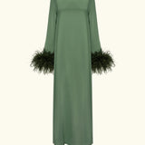 Woman wearing forest green satin midi dress with black feather cuffs and gold sandals — Sleeper | Endless UAE