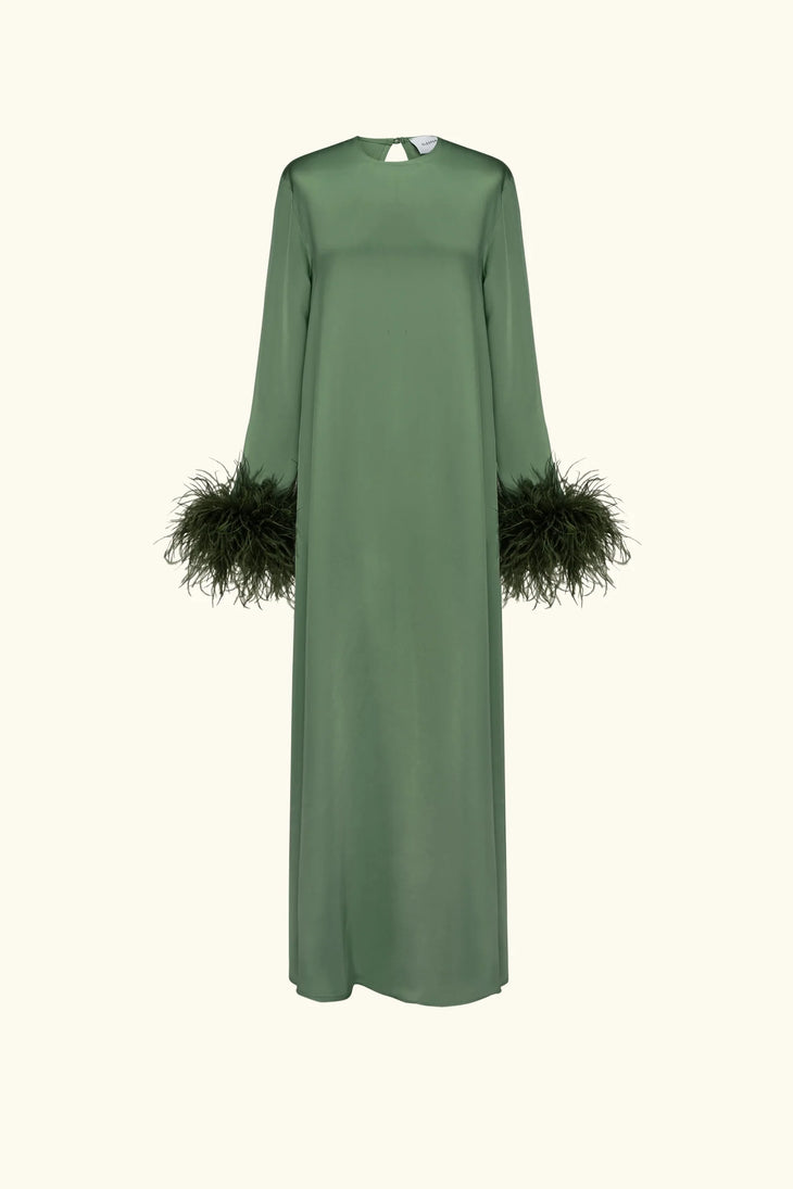 Woman wearing forest green satin midi dress with black feather cuffs and gold sandals — Sleeper | Endless UAE