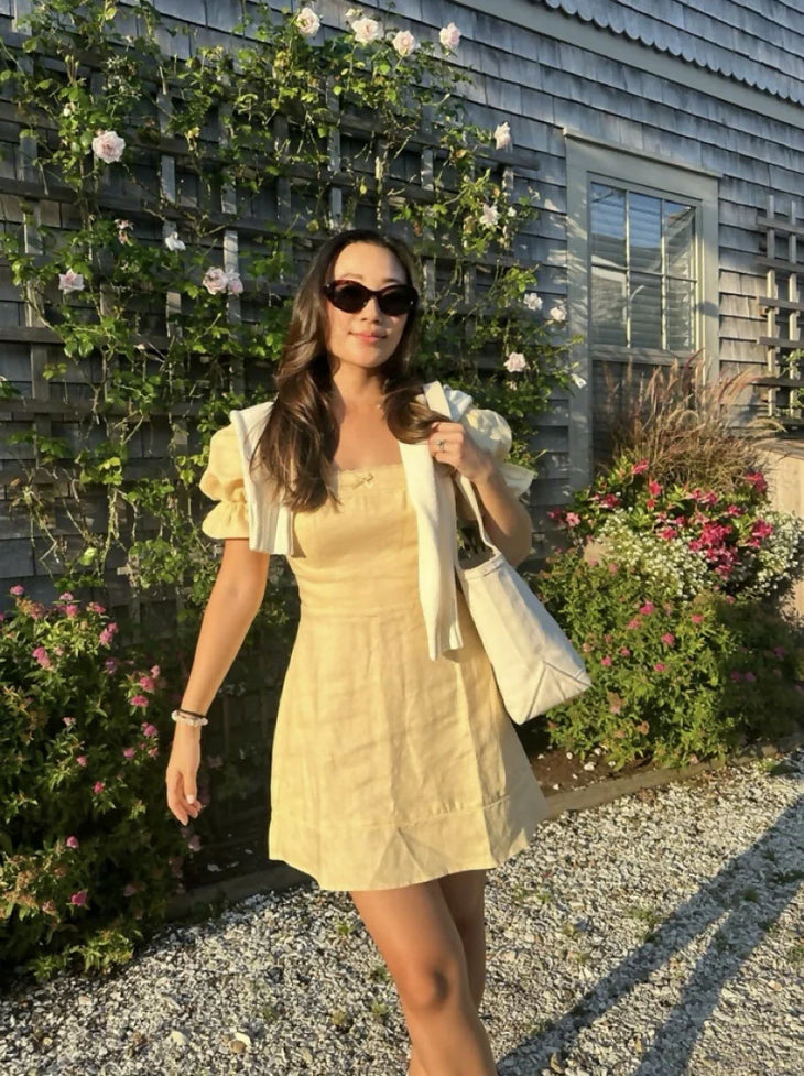 Evianna Linen Dress in pale yellow with square neckline and puff sleeves — Reformation | Endless UAE