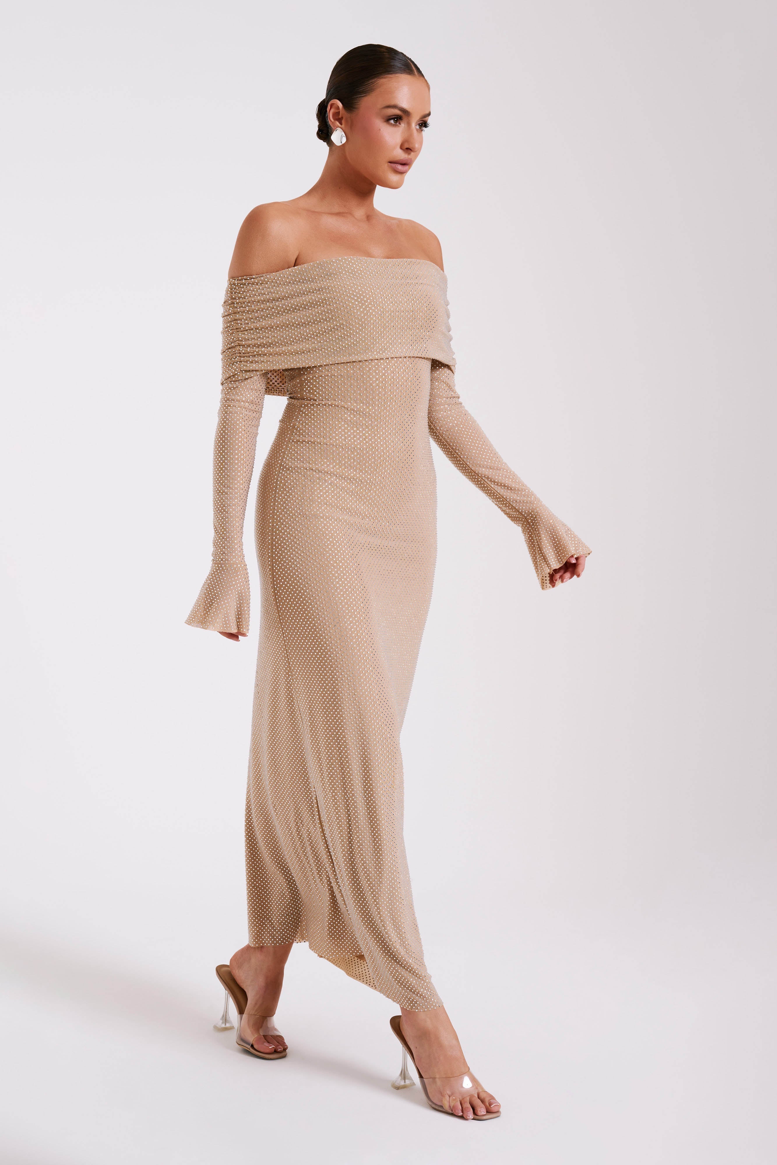 Woman wearing beige off-shoulder diamante maxi dress with long sleeves — Meshki | Endless UAE