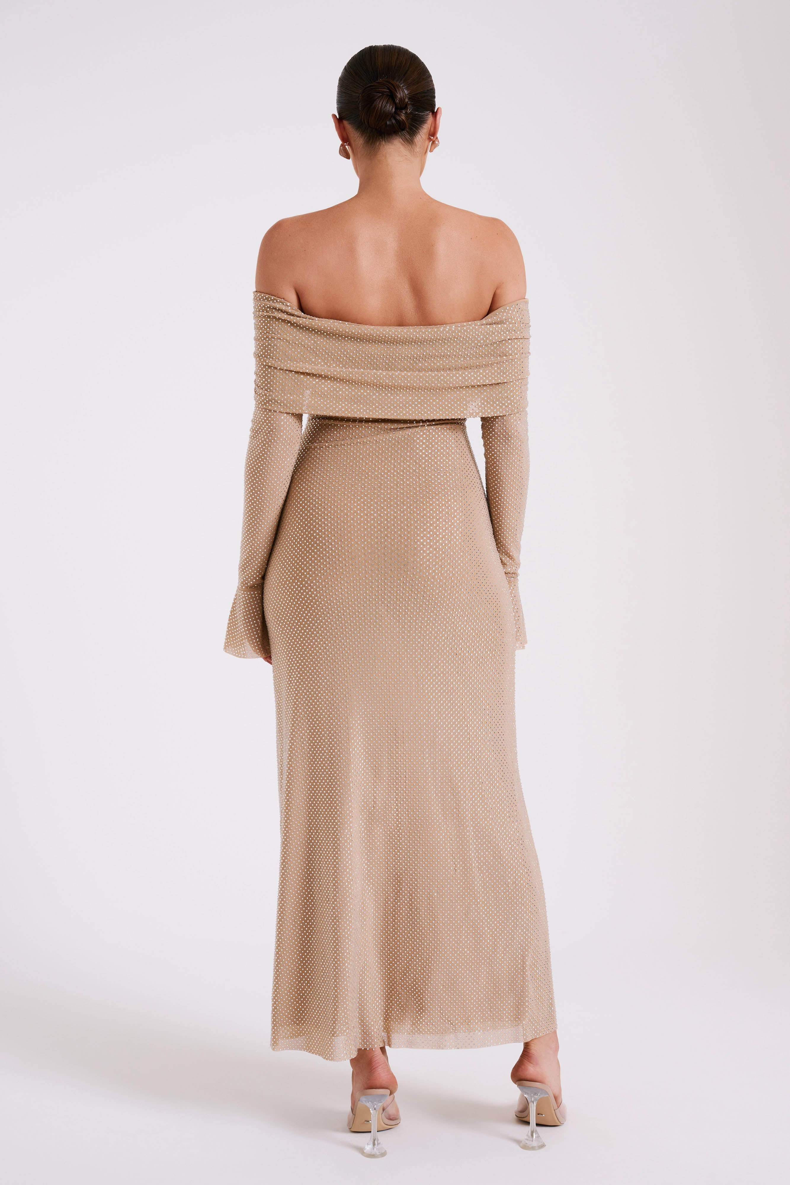 Woman wearing beige off-shoulder diamante maxi dress with long sleeves — Meshki | Endless UAE