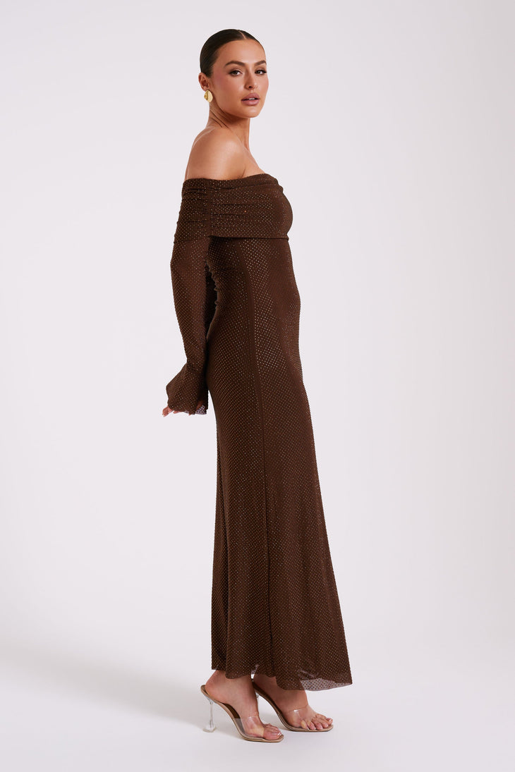 Brown off-shoulder maxi dress with diamante embellishments and long sleeves, paired with clear heels — Meshki | Endless UAE