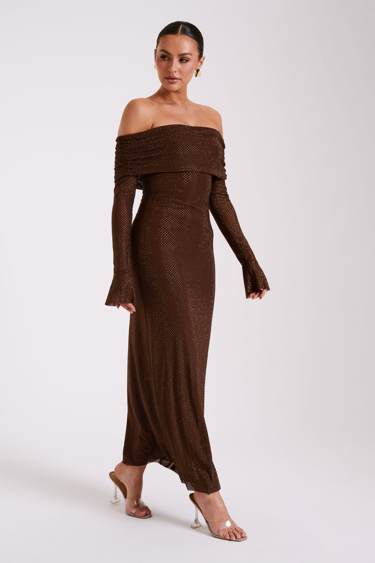 Woman wearing brown off-shoulder diamante embellished maxi dress with long sleeves and clear heeled sandals — Meshki | Endless UAE