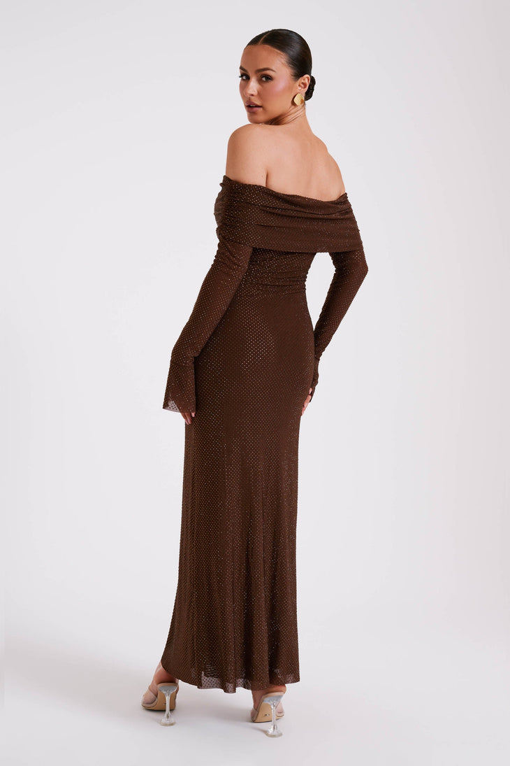 Woman wearing brown off-shoulder diamante embellished maxi dress with long sleeves and clear heels, back view — Meshki | Endless UAE