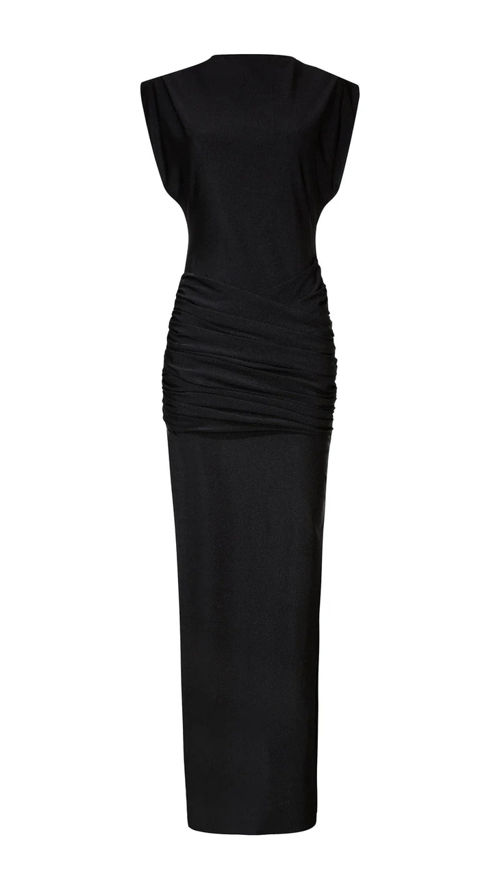 Woman wearing black sleeveless maxi dress with ruched side detail and gold bangles — Lediel | Endless UAE