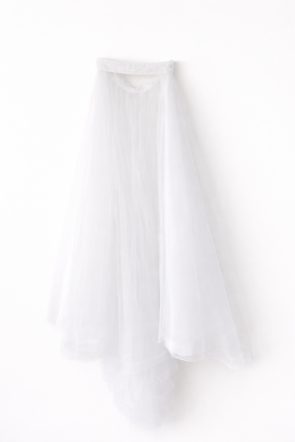 Elegant white lace wedding dress with long sleeves and flowing tulle train — Tatiana Kaplun | Endless UAE