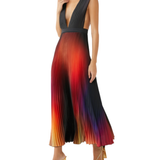 Woman wearing sleeveless pleated gala gown with charcoal top and ombre rainbow skirt — L'IDÉE | Endless UAE