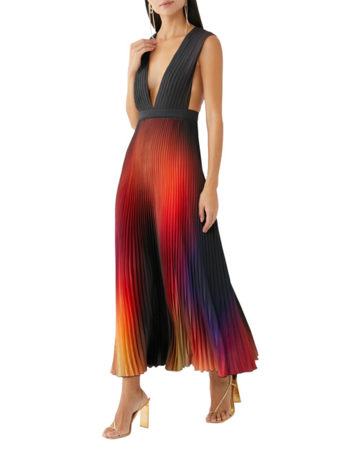 Woman wearing sleeveless pleated gala gown with charcoal top and ombre rainbow skirt — L'IDÉE | Endless UAE