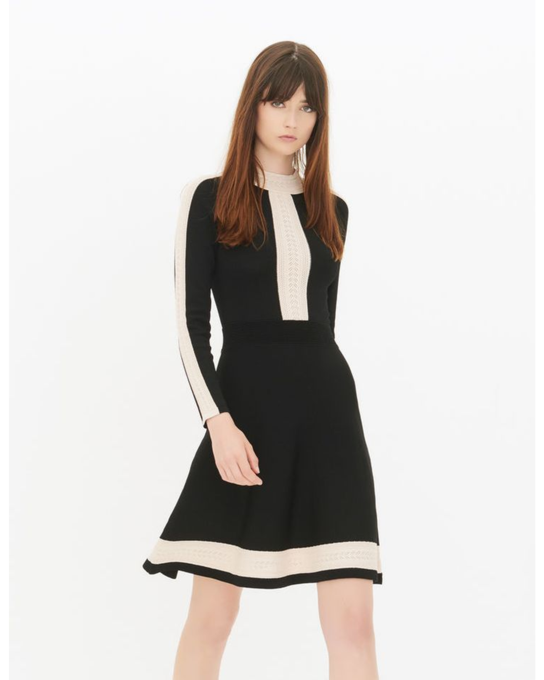 Black knit dress with cream contrast trim panel, long sleeves, and flared skirt silhouette — Sandro | Endless UAE
