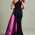 Black mermaid gown with magenta floral train and ruffled shoulder detail — In Couture | Endless UAE