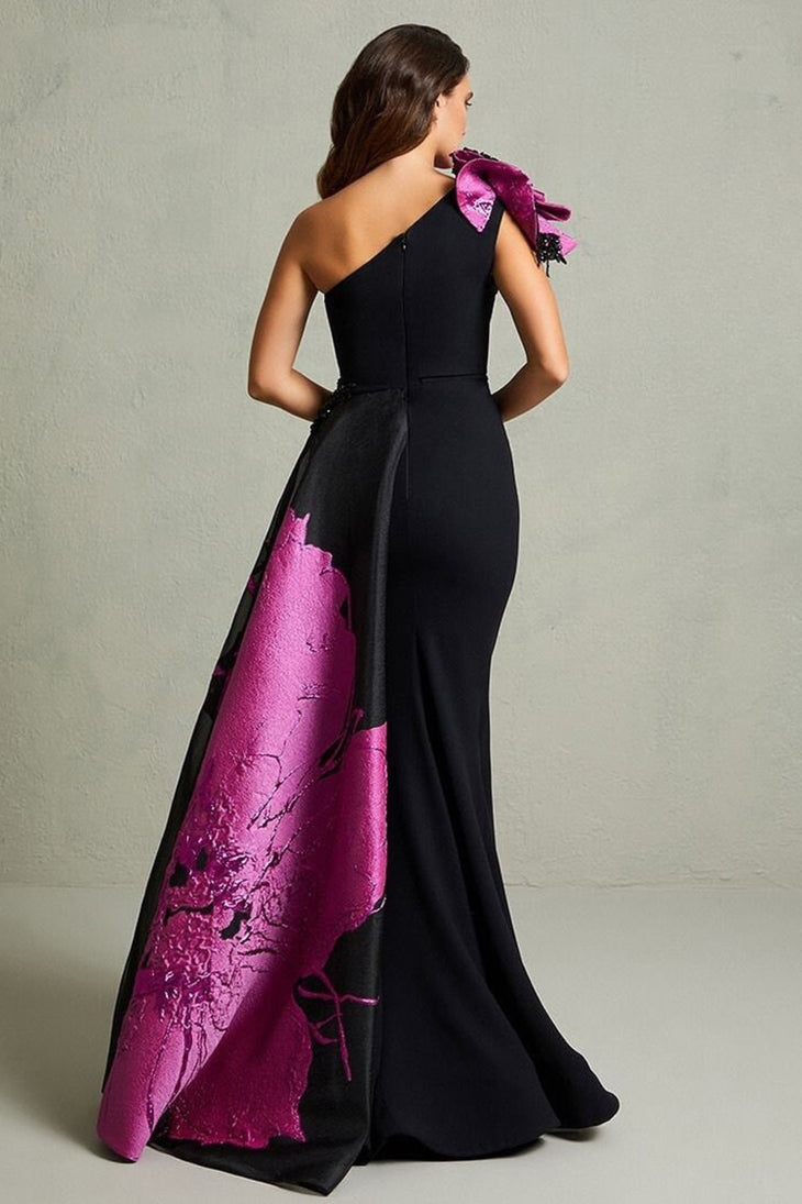 Black mermaid gown with magenta floral train and ruffled shoulder detail — In Couture | Endless UAE