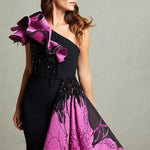 Black mermaid gown with magenta floral train and ruffled shoulder detail — In Couture | Endless UAE