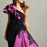 Black mermaid gown with magenta floral train and ruffled shoulder detail — In Couture | Endless UAE