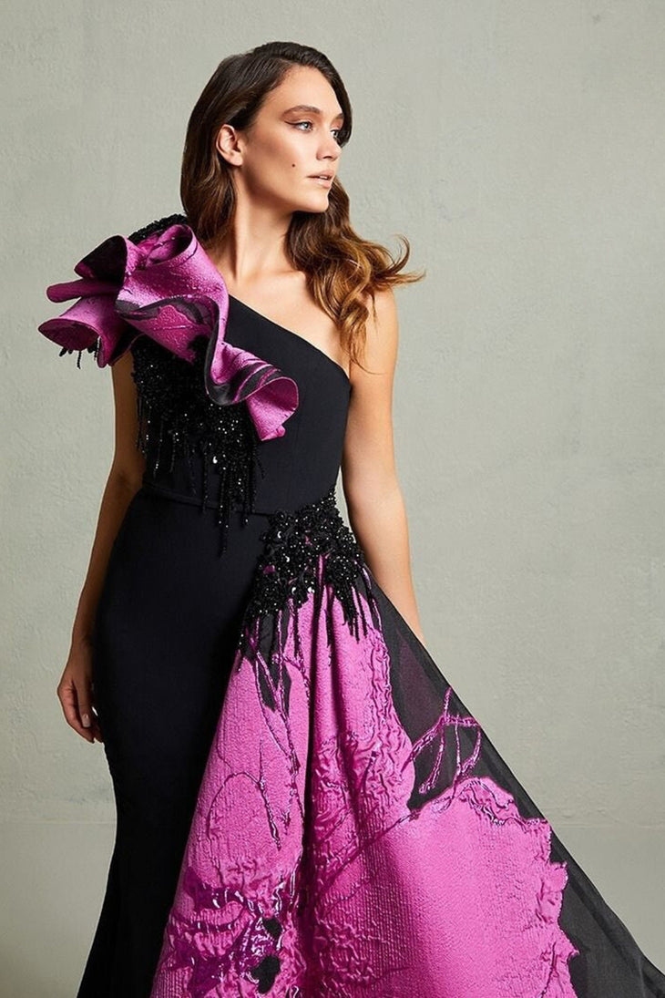 Black mermaid gown with magenta floral train and ruffled shoulder detail — In Couture | Endless UAE