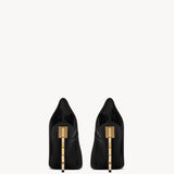 Black patent leather pointed-toe pumps with gold-tone YSL logo heel detail — Yves Saint Laurent | Endless UAE