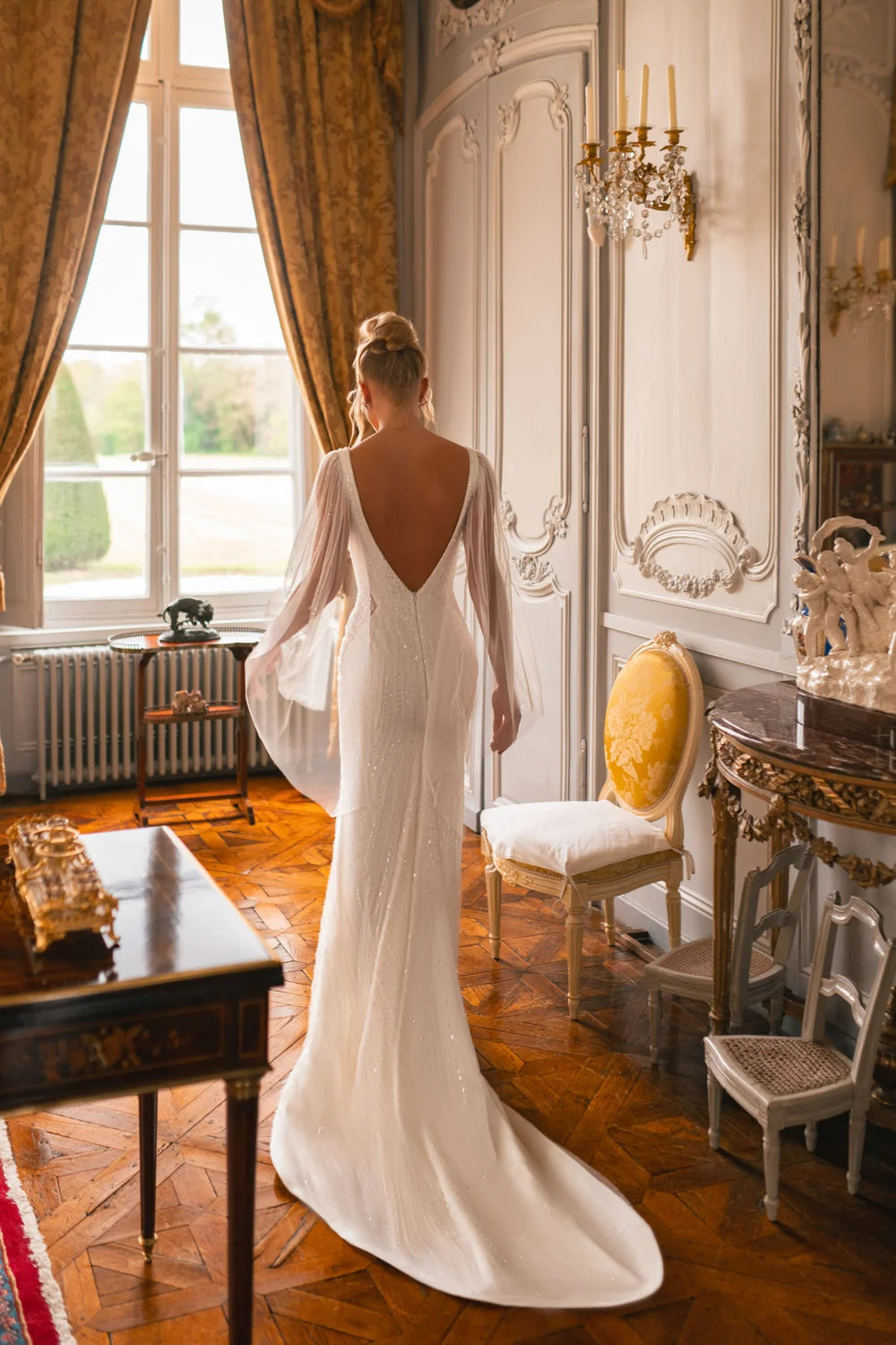 Embellished mermaid wedding dress with flowing cape and plunging neckline — Katy Corso Glen | Endless UAE
