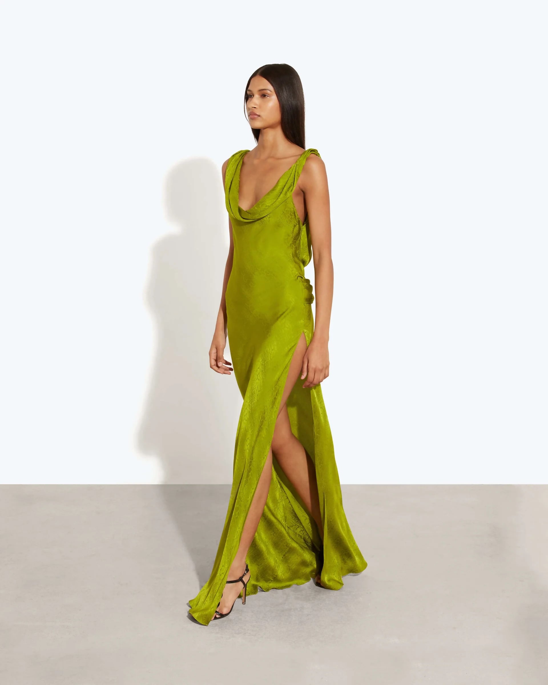 Lime green satin maxi dress with cowl neckline and high slit, worn by model on white background — Rat and Boa | Endless UAE