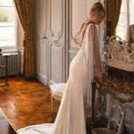 Embellished mermaid wedding dress with flowing cape and plunging neckline — Katy Corso Glen | Endless UAE
