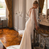 Embellished mermaid wedding dress with flowing cape and plunging neckline — Katy Corso Glen | Endless UAE