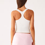 Woman wearing white halter top and pink sequin mini skirt — Peppermayo | Endless UAE