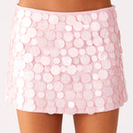 Woman wearing white halter top and pink sequin mini skirt — Peppermayo | Endless UAE