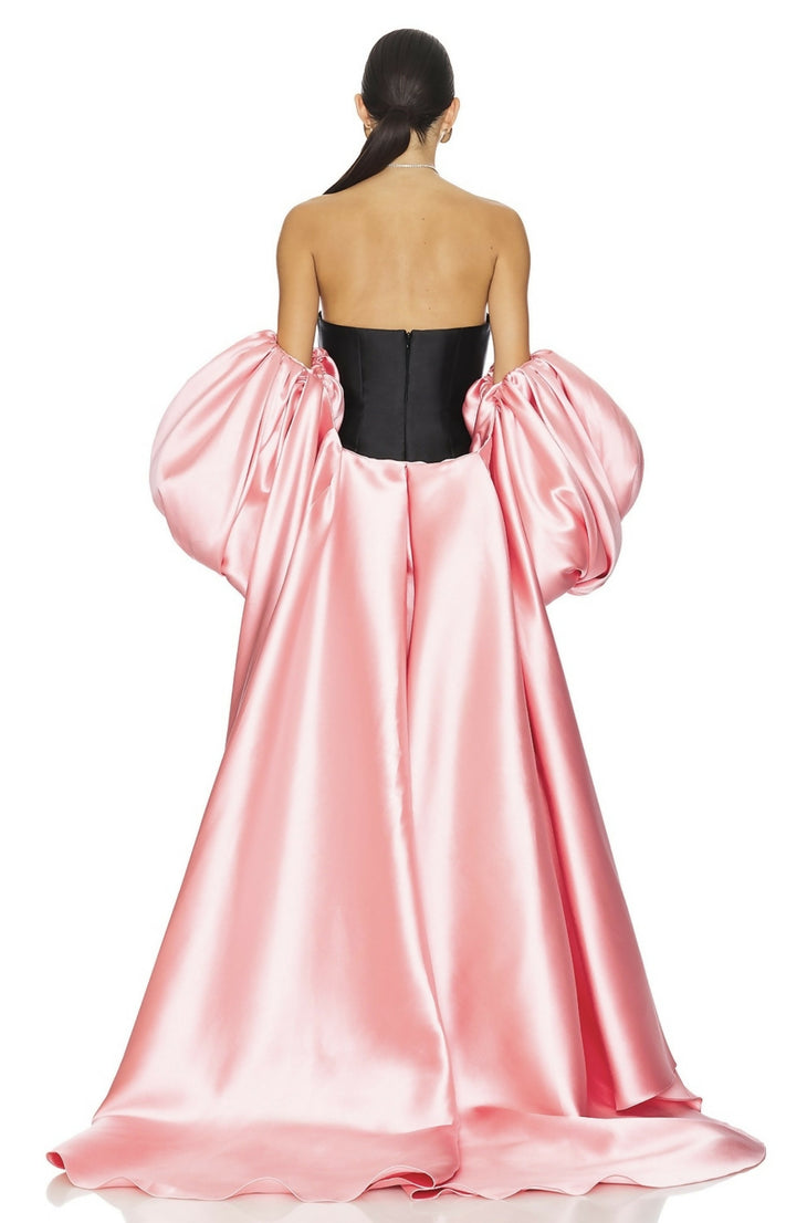 A dramatic pink satin maxi dress with black corset bodice and voluminous puff sleeves, shown from back — Solace London | Endless UAE