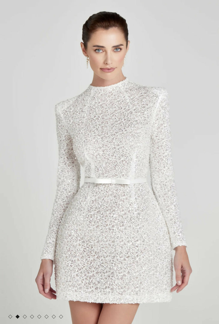 Elegant white sequined mini dress with long sleeves and crew neckline, featuring all-over embellishment and waist belt detail — Nadine Merabi | Endless UAE